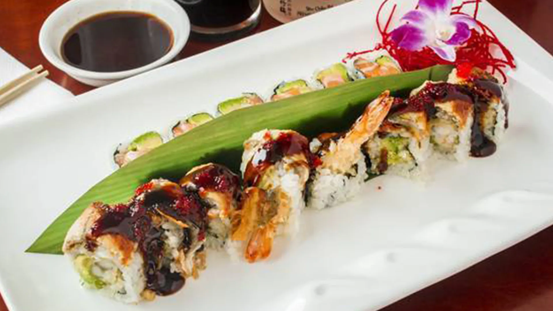 Tempura shrimp sushi roll with eel sauce at Musashi & Mizu Sushi, an Asian Fusion Restaurant in Brooklyn
