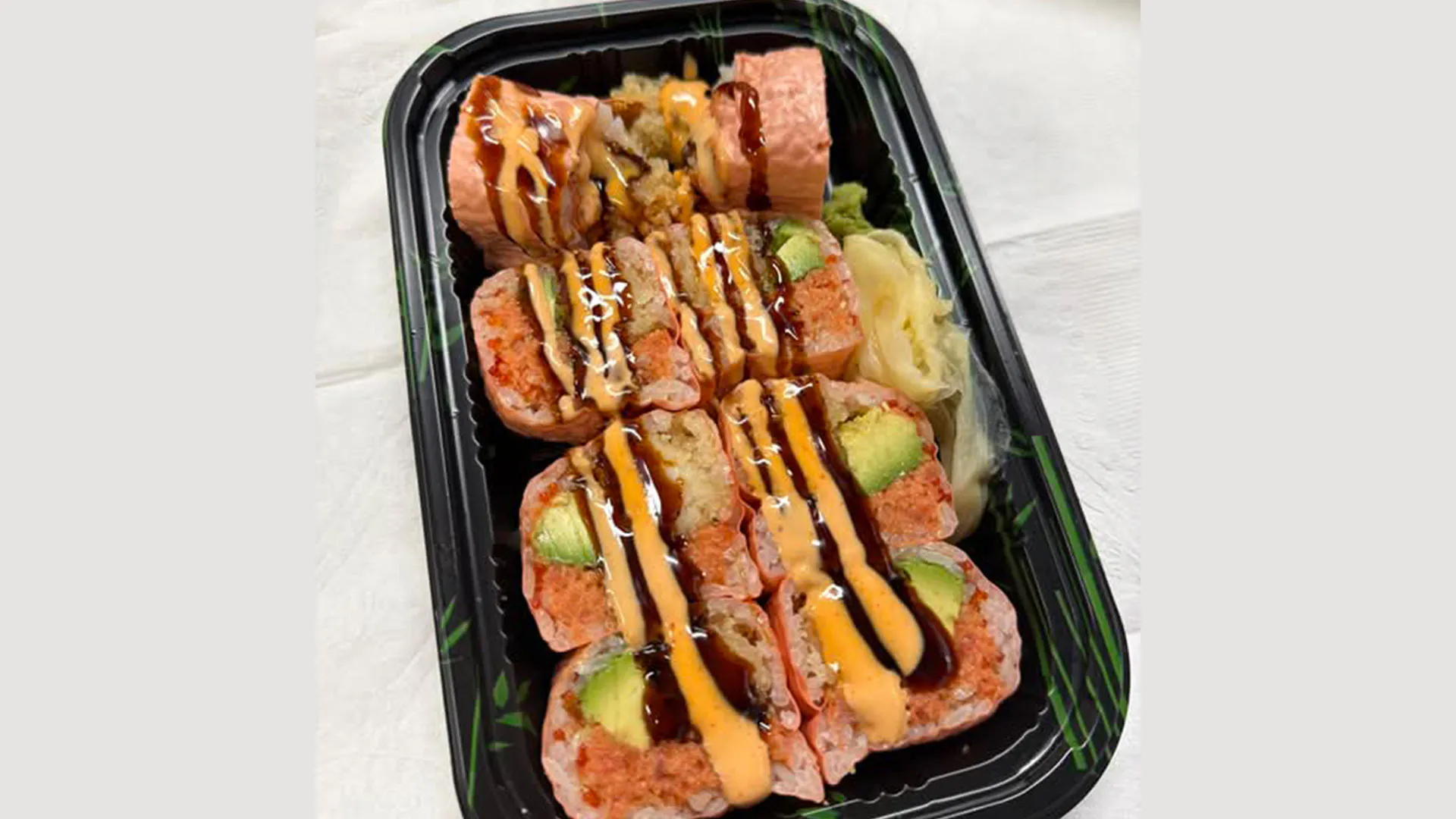 Spicy tuna avocado roll with two sauces at Musashi & Mizu Sushi, an Asian Fusion Restaurant in Brooklyn
