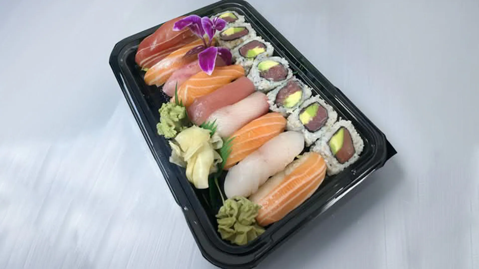 Sushi platter with assorted nigiri and tuna rolls at Musashi & Mizu Sushi, an Asian Fusion Restaurant in Brooklyn